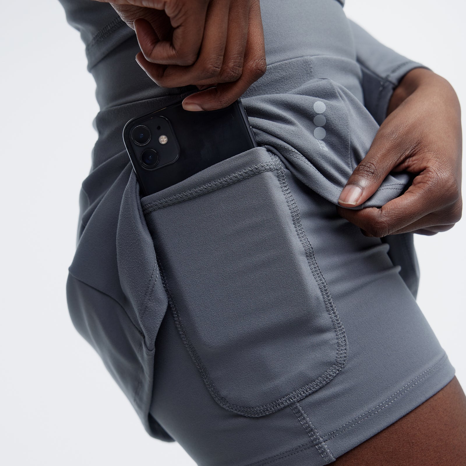 close up of pocket holding cell phone