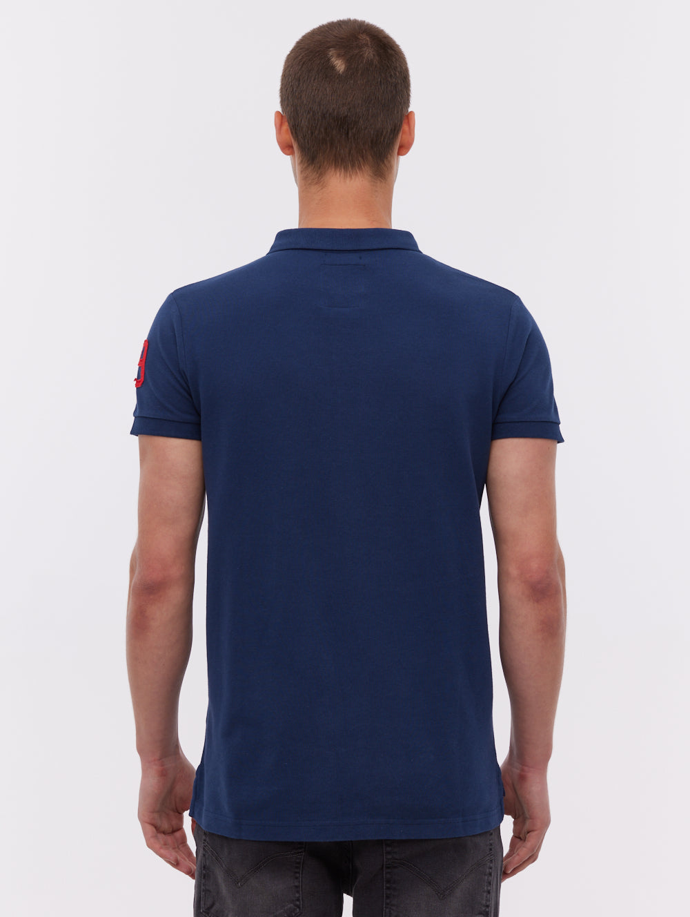 Duchal polo avec appliqué universitaire