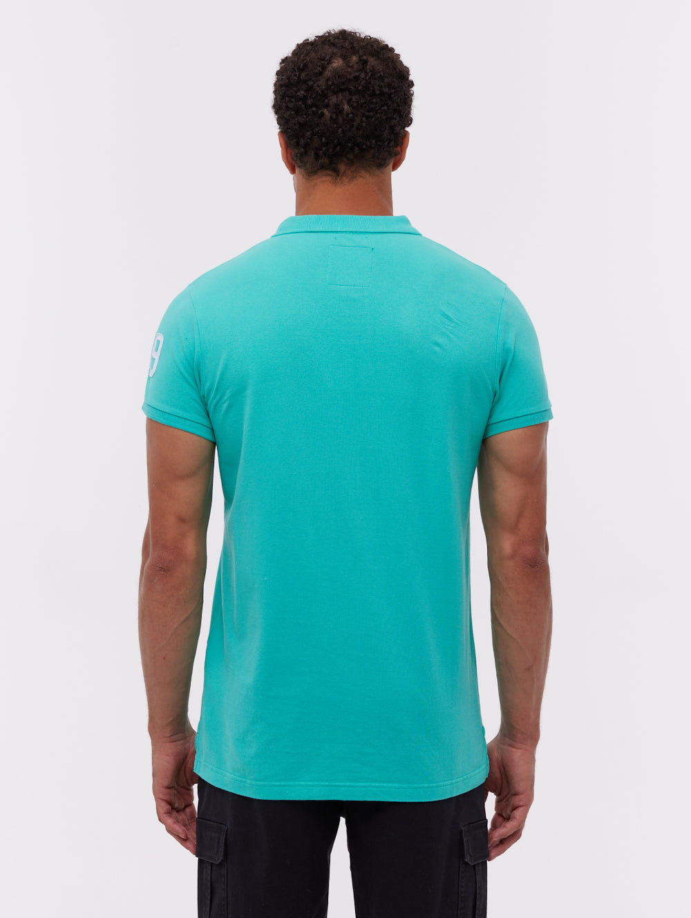 Duchal polo avec appliqué universitaire