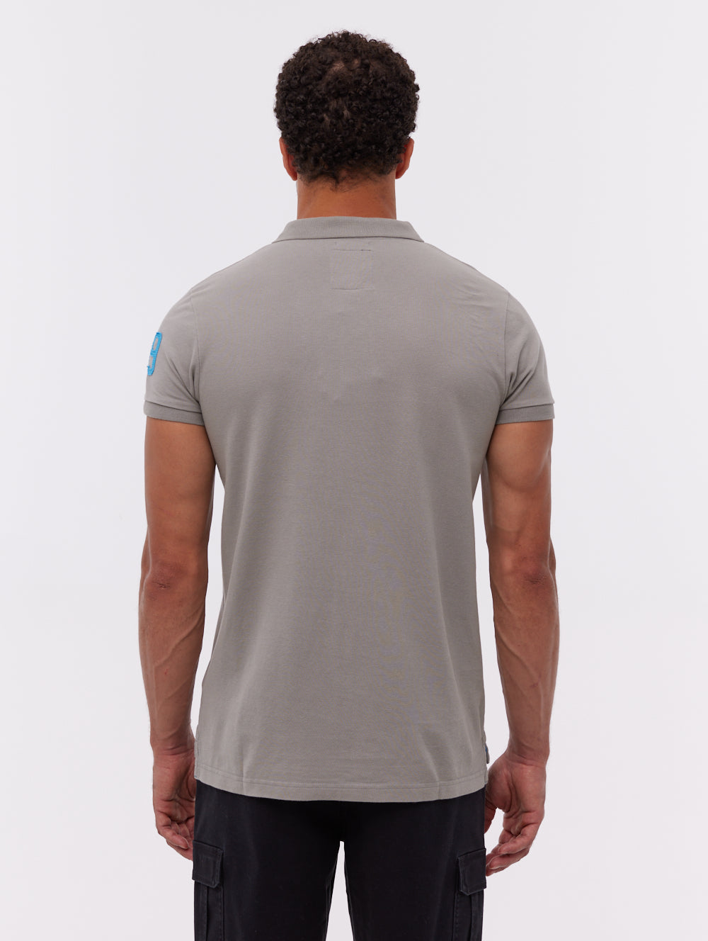 Duchal polo avec appliqué universitaire